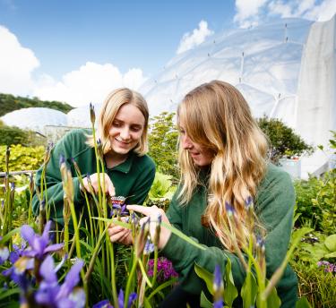 Horticulture students examining flowers at the Eden Project